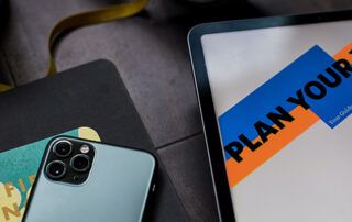 Tablet, phone and notebook on desk