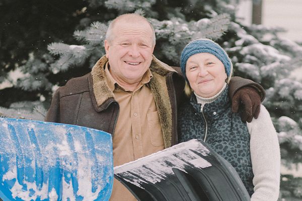 Retired Couple With Tree In Background