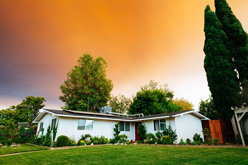 House With Landscaping and Sunset