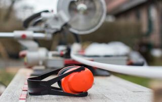 Orange Ear Protection on Work Table