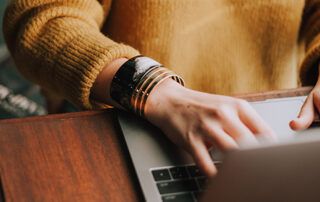 Woman's hands on computer