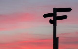 Guide Post Shadowed with Sunset