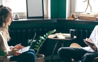 Couple Discussing Financials in Livingroom