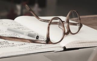 Glasses on Research Notebook