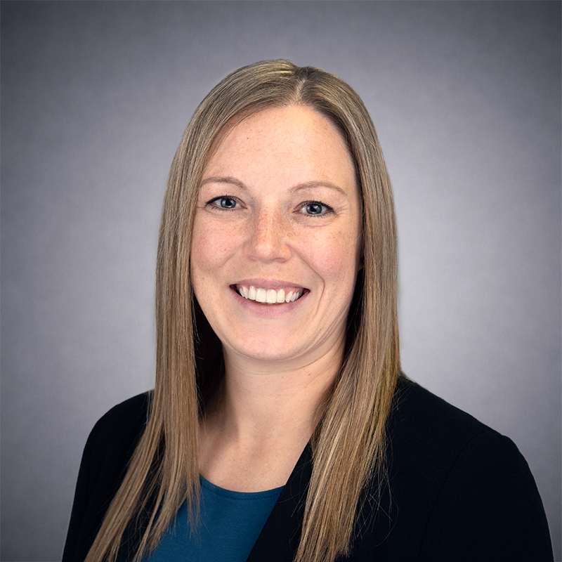 Krystal Hanson, Wearing a Blue Shirt and Black Jacket