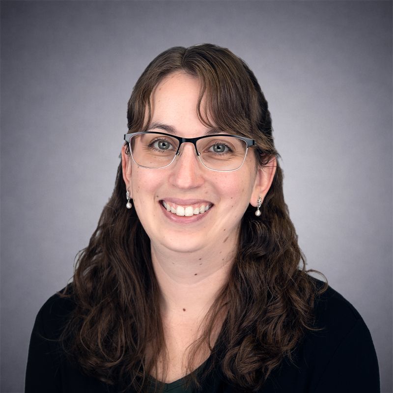 Megan Curtis wearing a Green Top and Black Cardigan